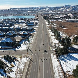 An aerial view of MCINTYRE STREET, a snow covered road undergoing RECONSTRUCTION.