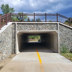 A yellow line bridge on the Boulder Canyon Trail extension.
