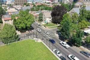 An aerial view of Capitol Hill, a city street adorned with cars and trees.